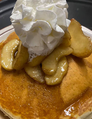Pancakes with apple and whipped cream